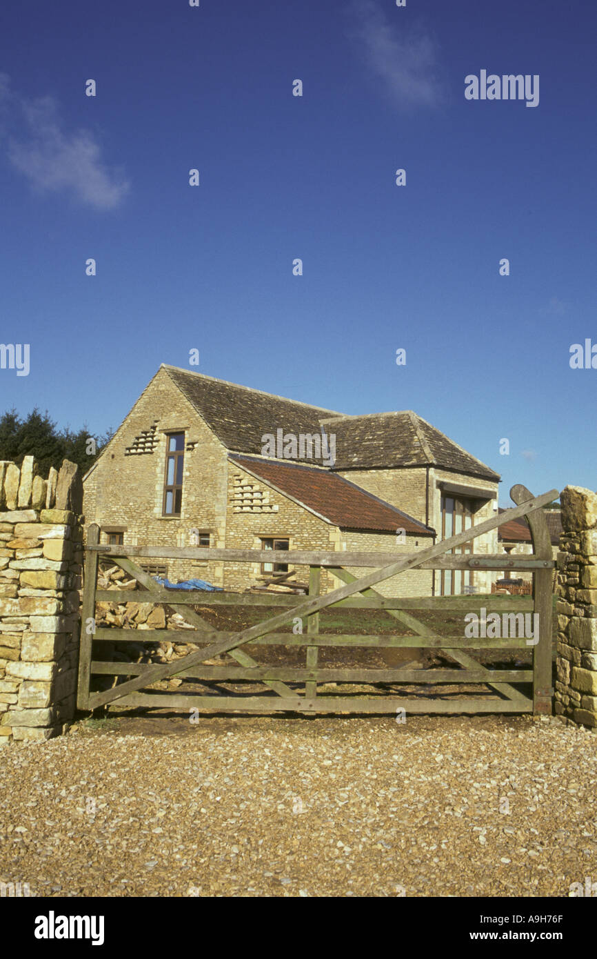 Construction Old Stone Barn conversion to house in former farmyard Glos Stock Photo