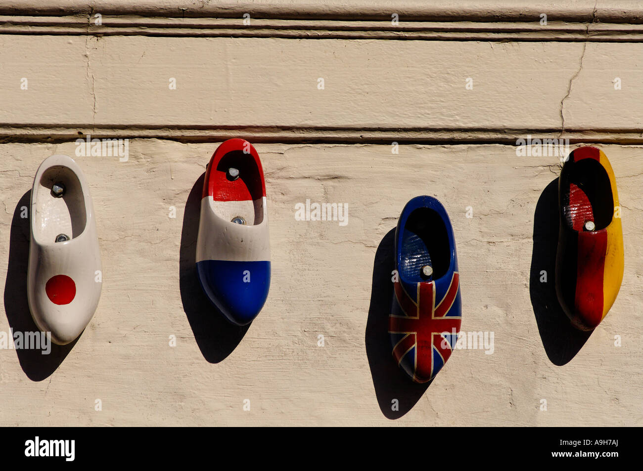 Nationalised clogs on a wall in Bruges Belgium Stock Photo