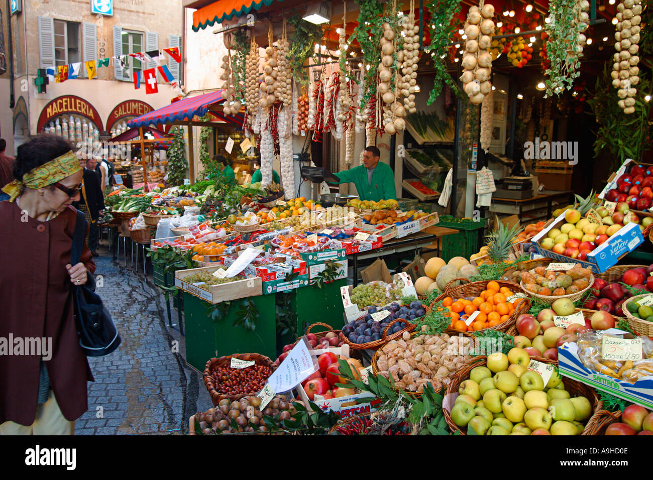 Switzerland Tessin Lugano old city center Via Pessina fruit and vegetable stall delicatessen customers outdoor Stock Photo