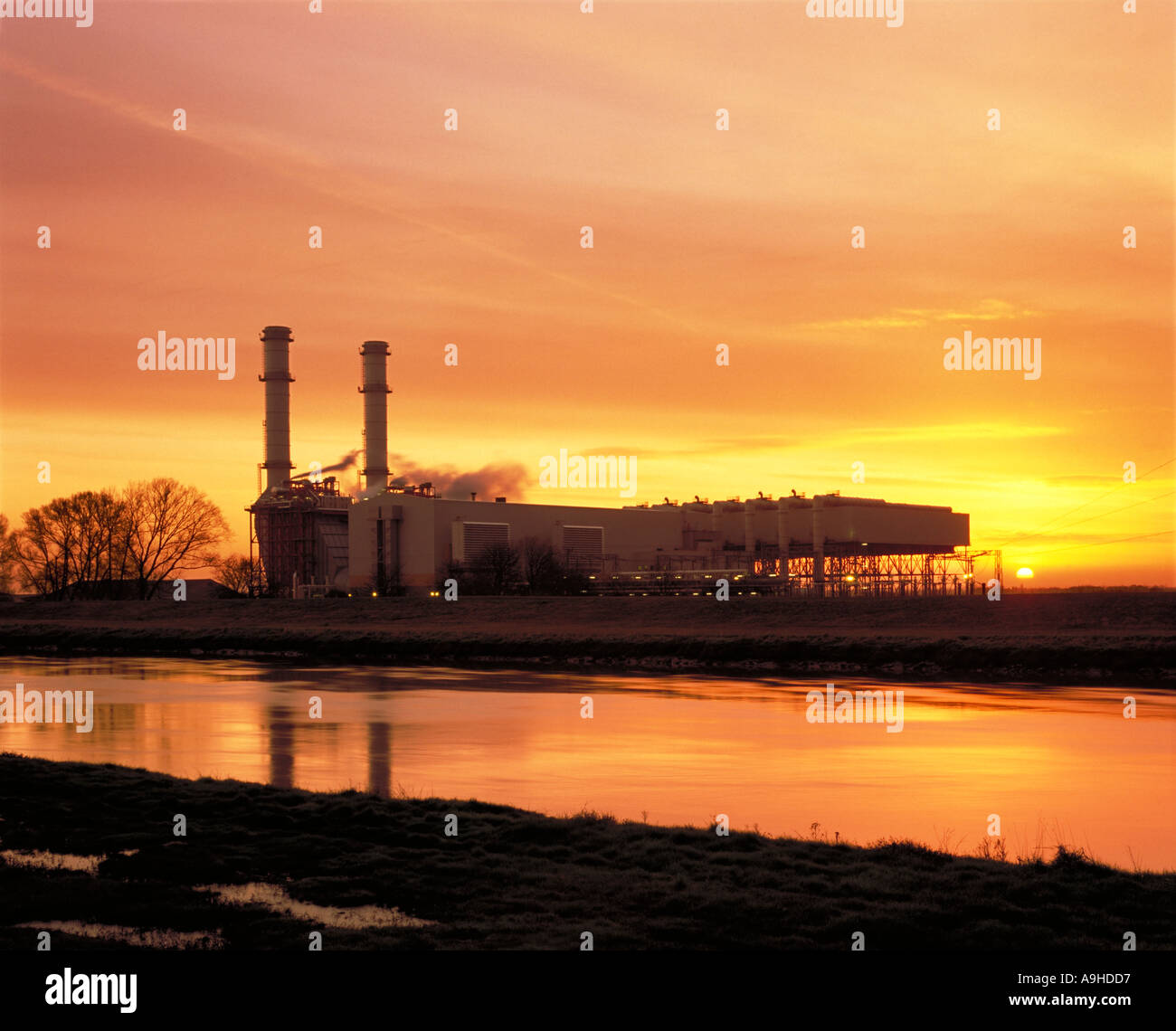 Sutton Bridge combined cycled gas fired and steam driven turbine power station, at dawn, situated beside River Nene at dawn,.Lincolnshire, UK Stock Photo