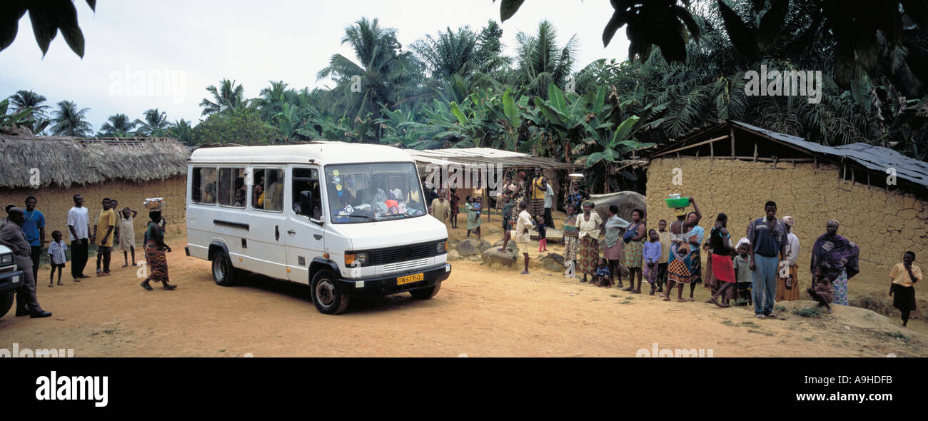 School bus supplied by local mining company, carrying children safely to school after leaving village of Teberebie, Western Ghana Ashanti Region Stock Photo