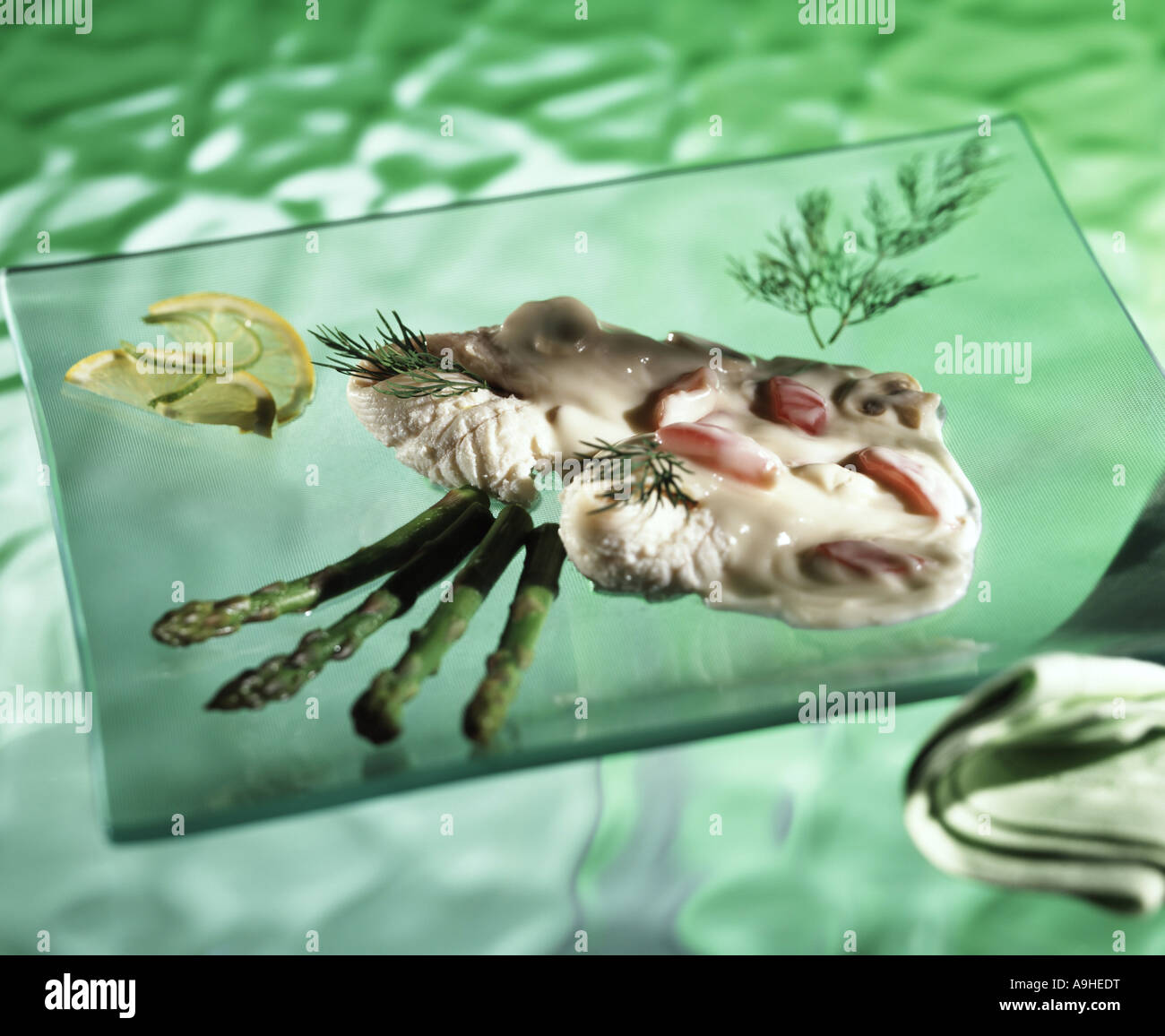 fish in white wine and mushroom sauce Stock Photo Alamy