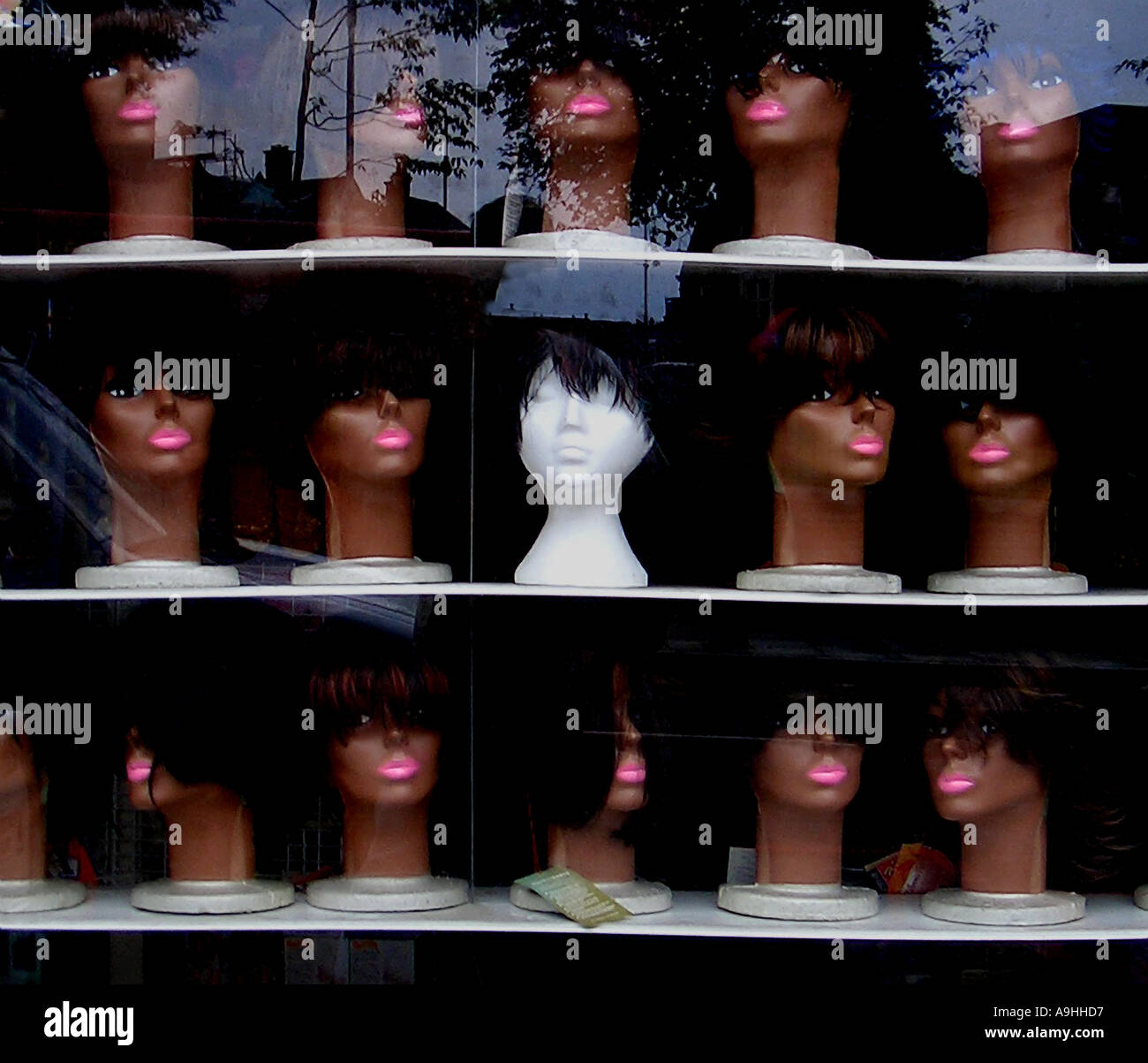 Wigs in shop window Streatham S London Stock Photo Alamy