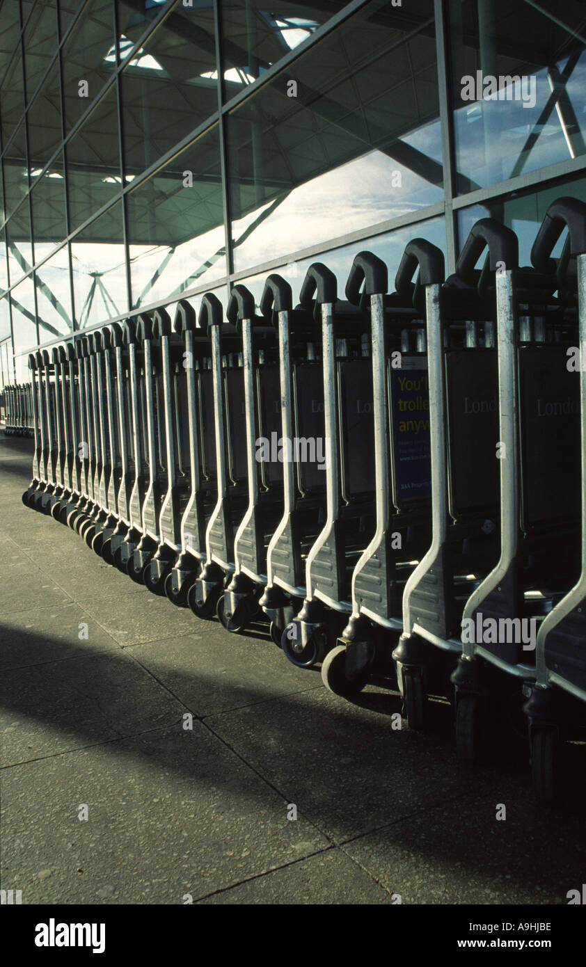 Luggage trolleys outside Stansted Airport Essex England Stock Photo Alamy