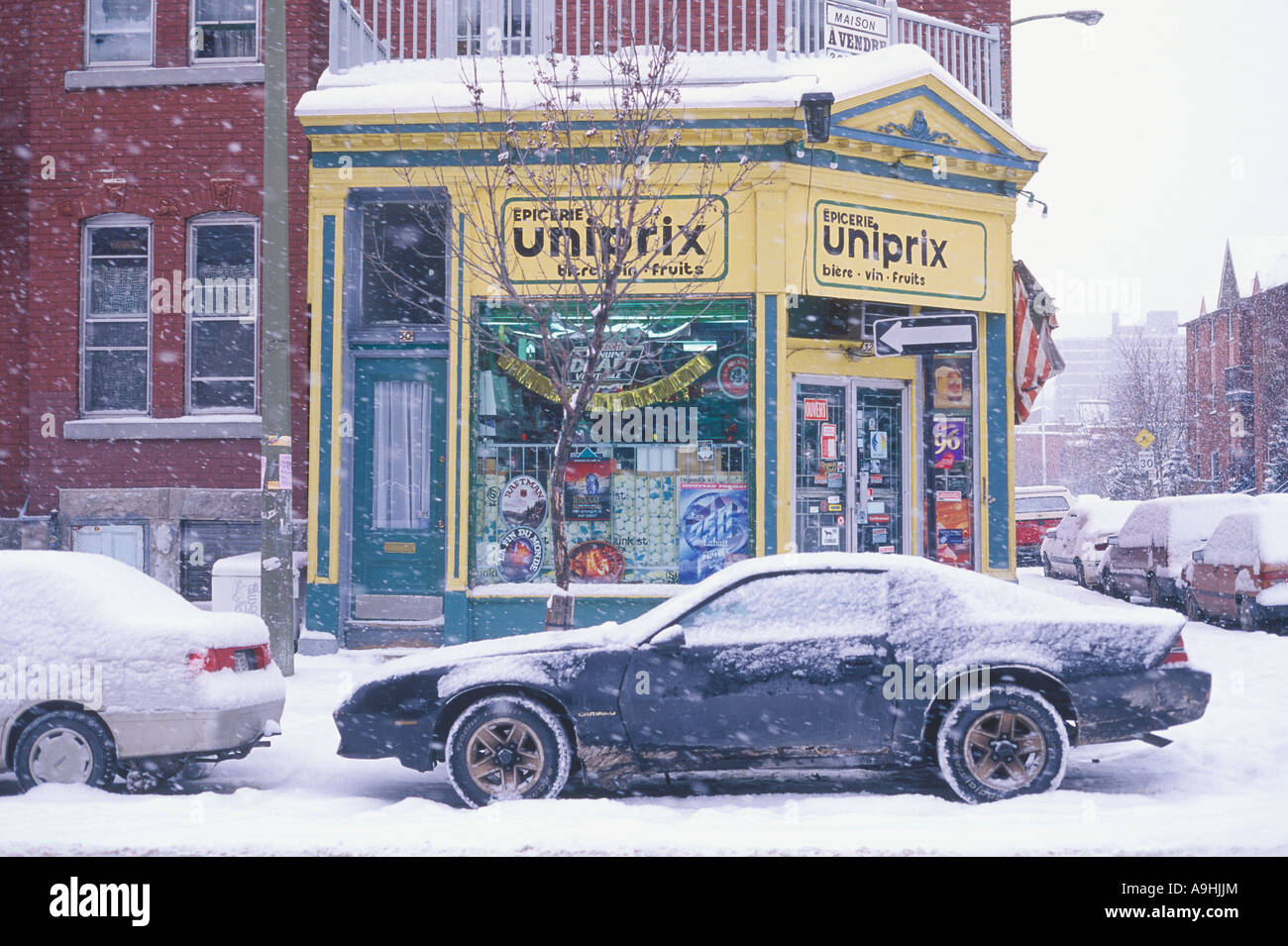 Corner variety store in the heart of an inner city winter snowfall