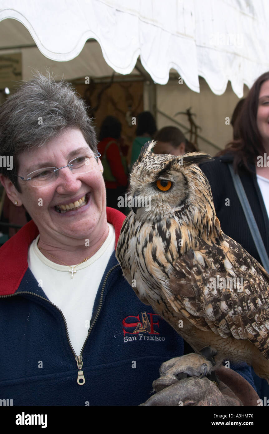 Woman holding a eagle owl Stock Photo