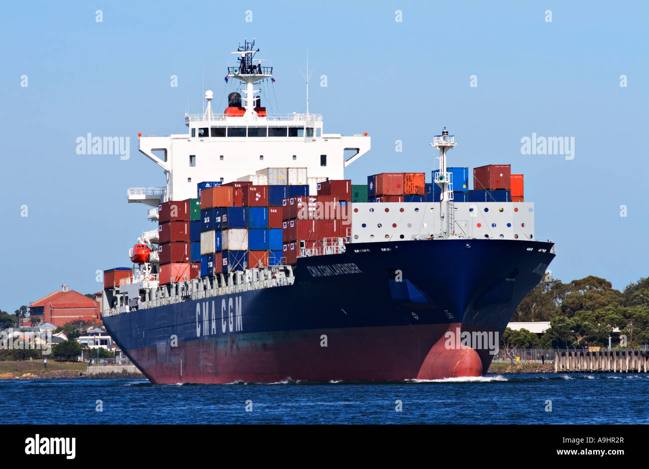 Shipping Industry / Shipping Containers stacked on the deck of a ...