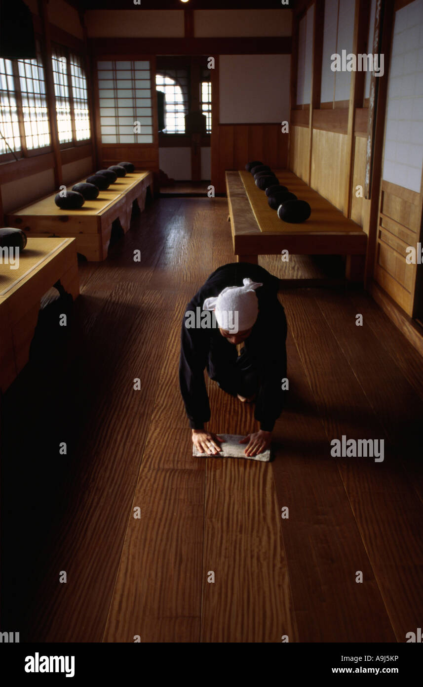A Zen monk of the Soto School cleans the meditation hall in the traditional manner at the Seiryu ...