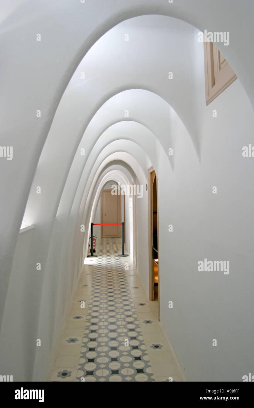 Barcelona Casa Batllo by Antoni Gaudi arcades all in white in the top floor passage  Stock Photo