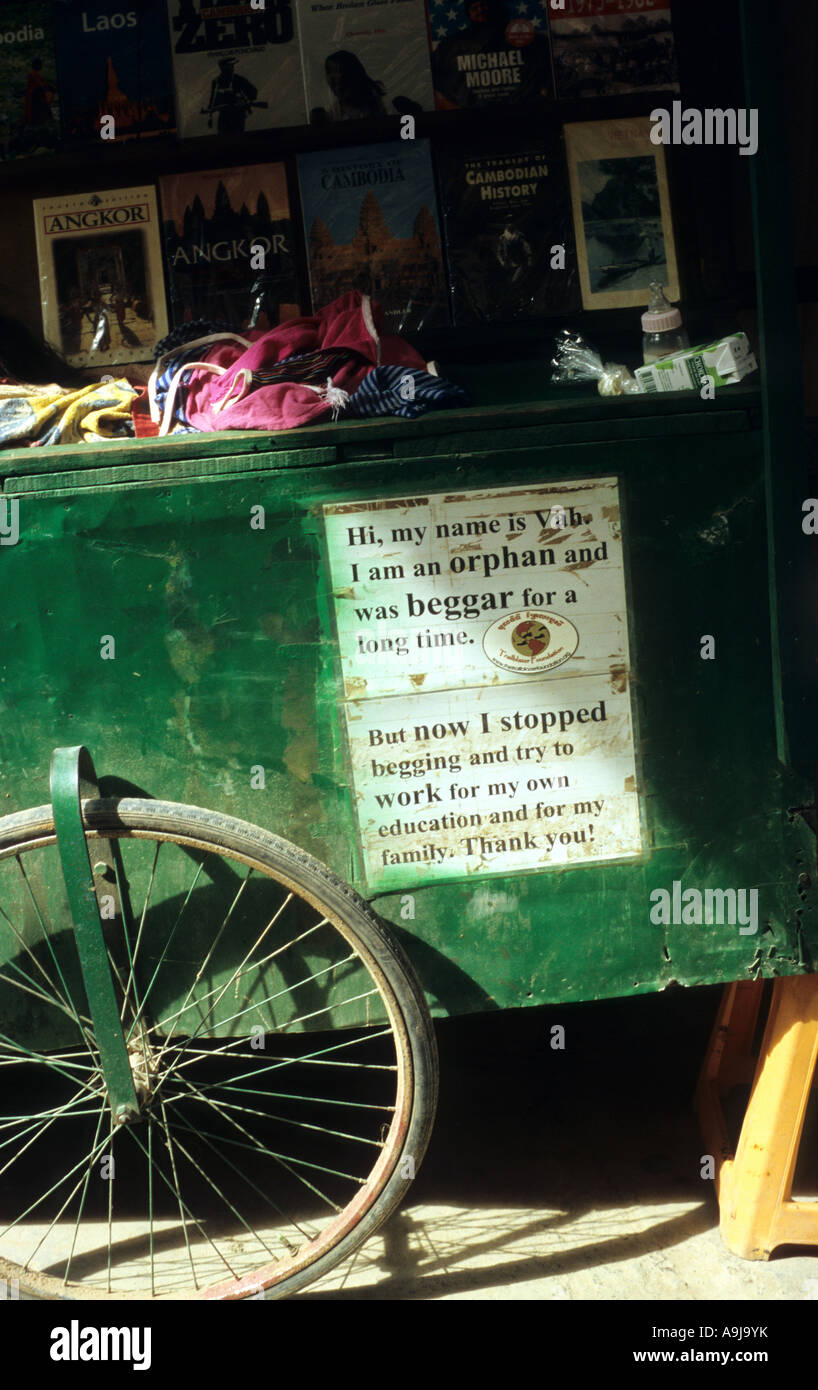 Book sellers' push cart with no begging sign, Siem Reap, Cambodia Stock Photo