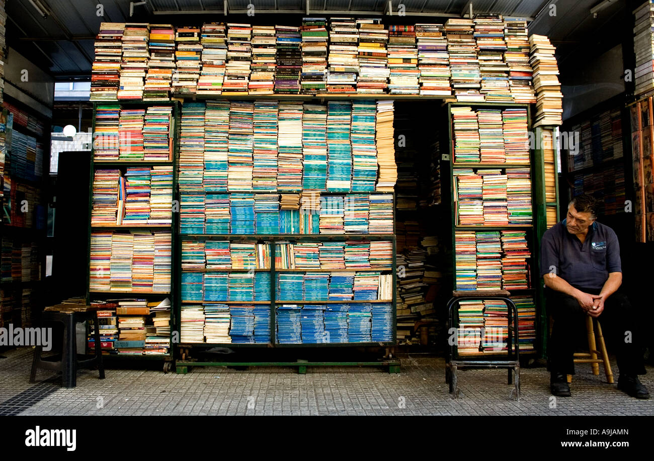 A bookseller next to his street stall near the Universidad de Chile metro on San Diego street. Stock Photo