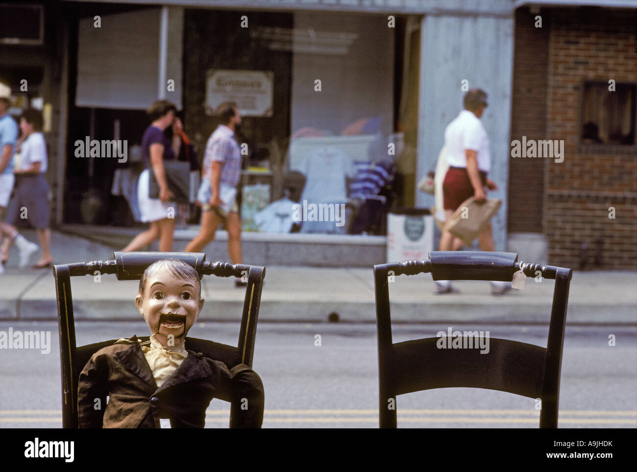 Canada Canadian North America ventriloquist dummy on sidwalk chair