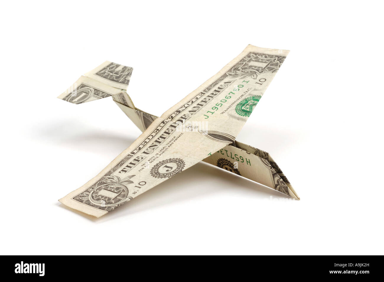 Airplane made of dollar bills Stock Photo