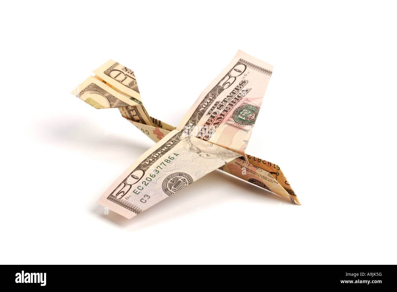 airplane made of dollar bills Stock Photo