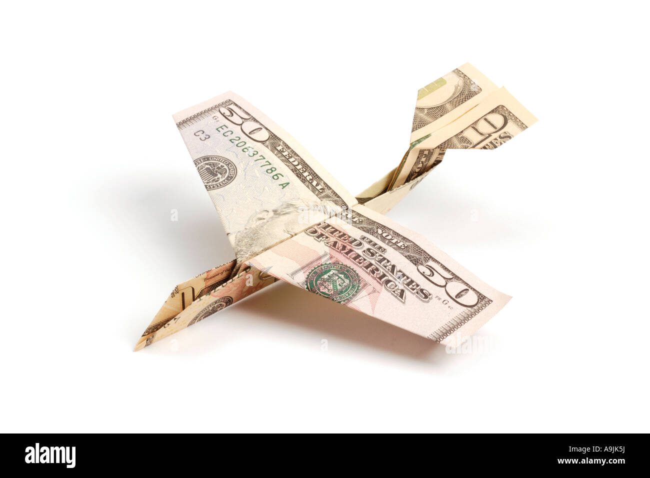 Airplane made of dollar bills Stock Photo