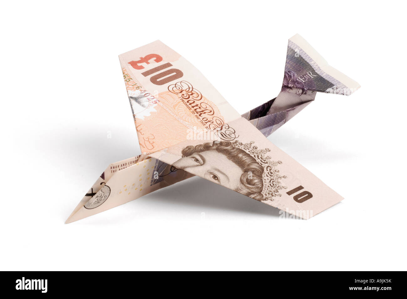 Airplane made of pound notes Stock Photo