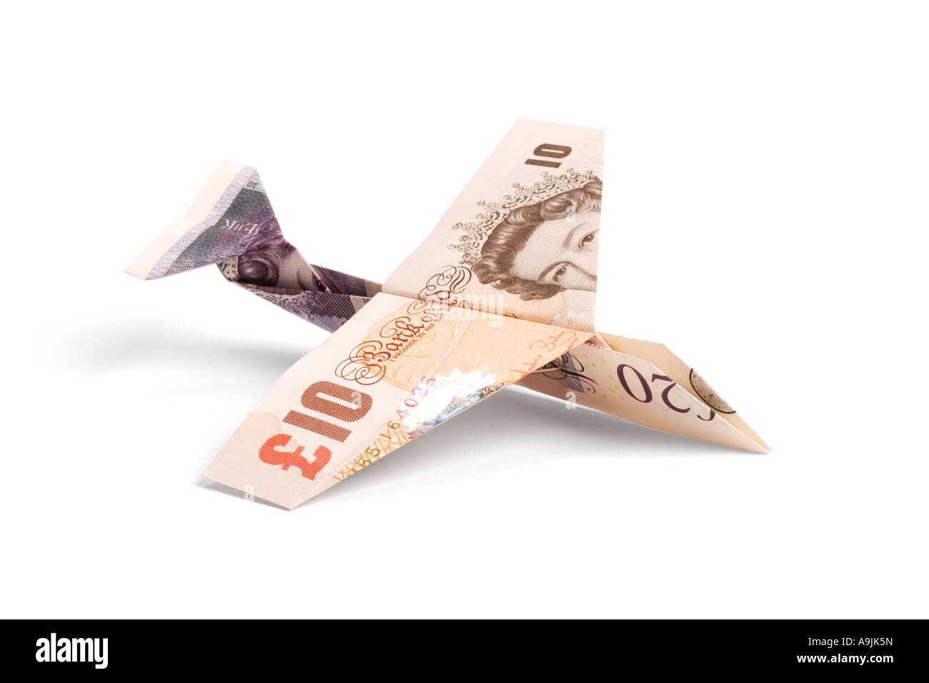 Airplane made of pound notes Stock Photo