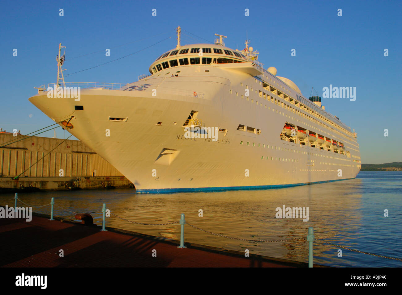 Regal Princess cruise ship docked at port of Victoria in early morning ...