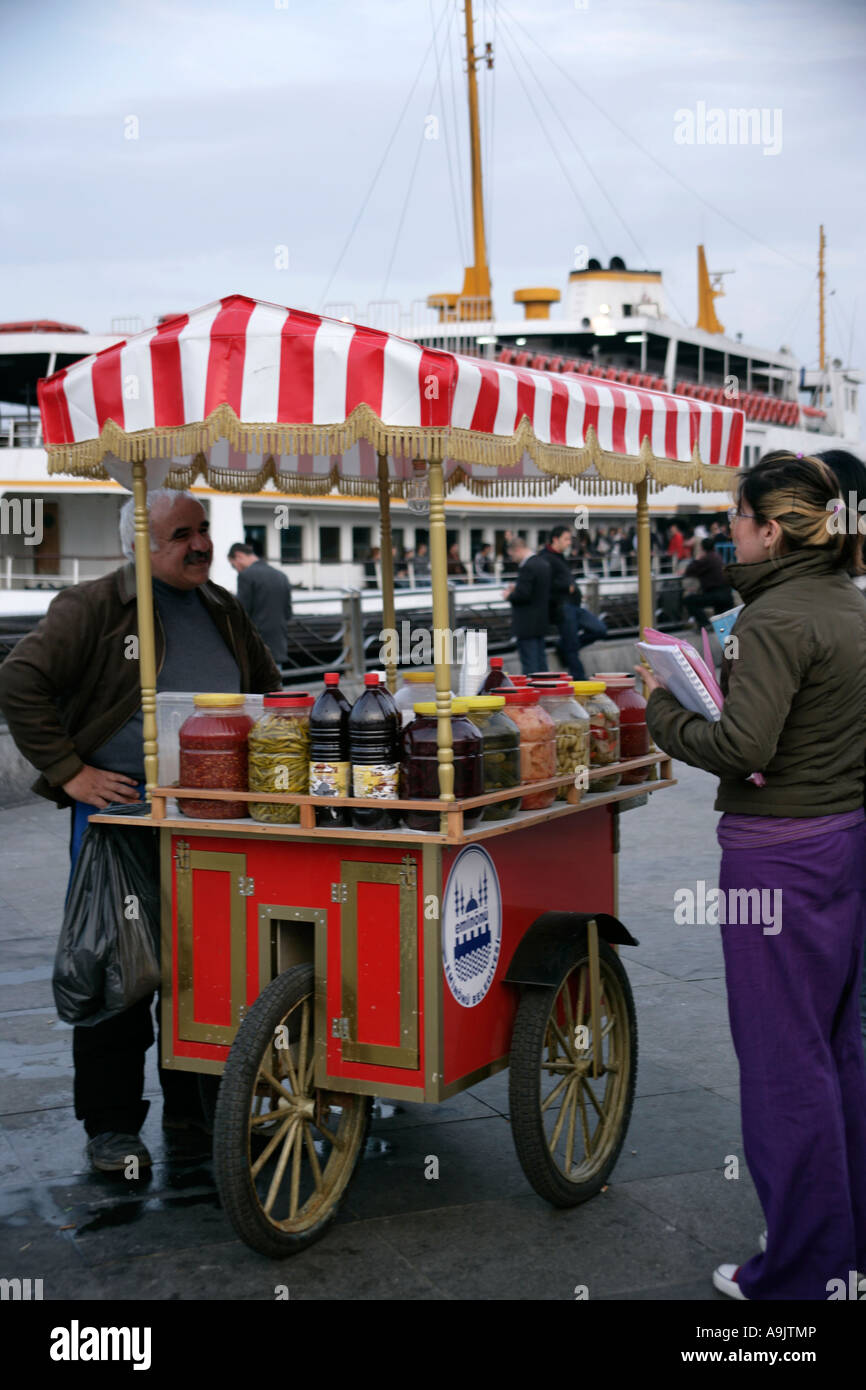 Buying tursu or pickled juices as takeaway on the street, Istanbul