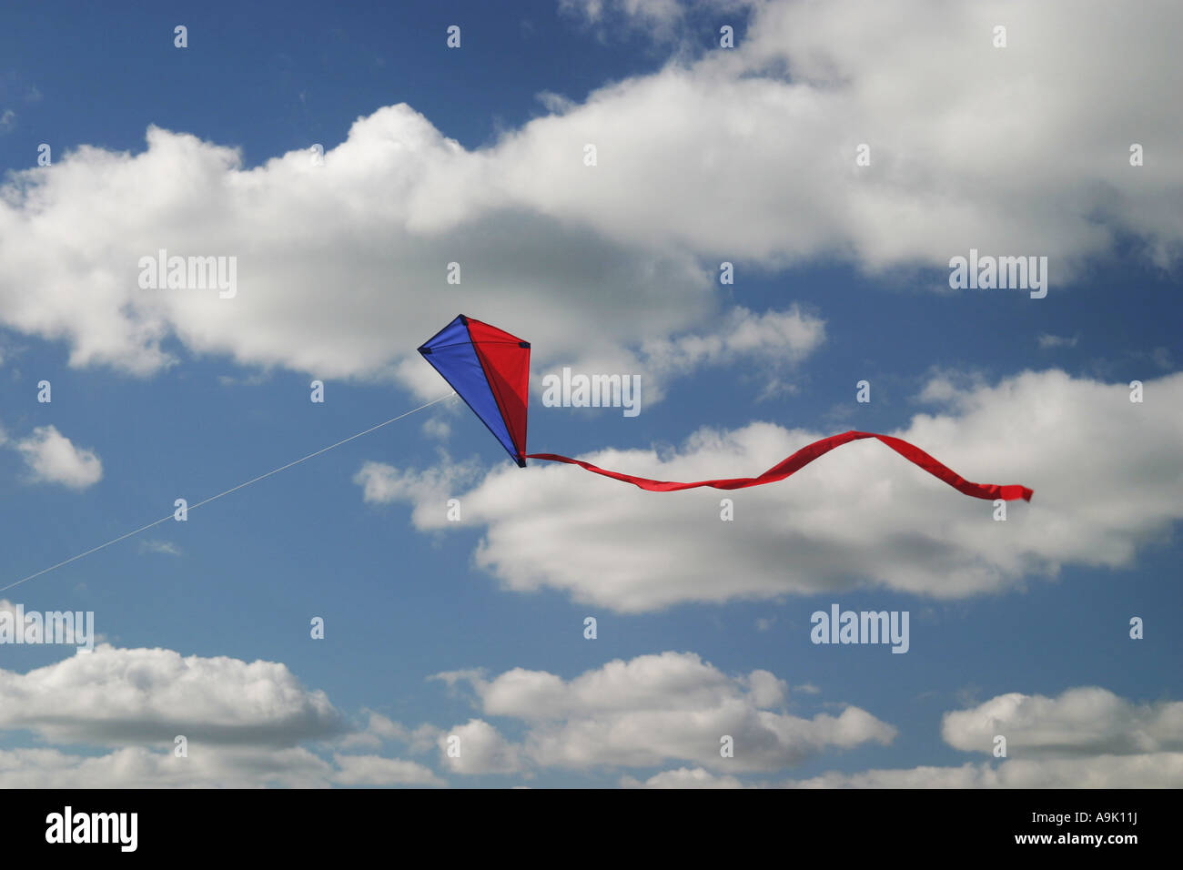 a kite flying high in the sky Stock Photo