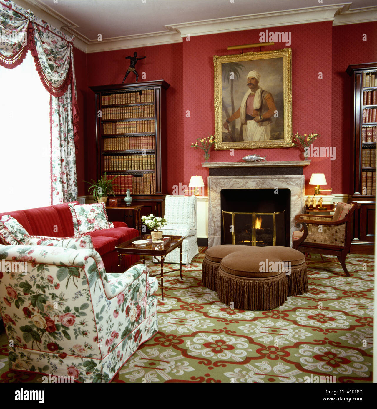 Upholstered brown stool and floral patterned carpet in red eighties