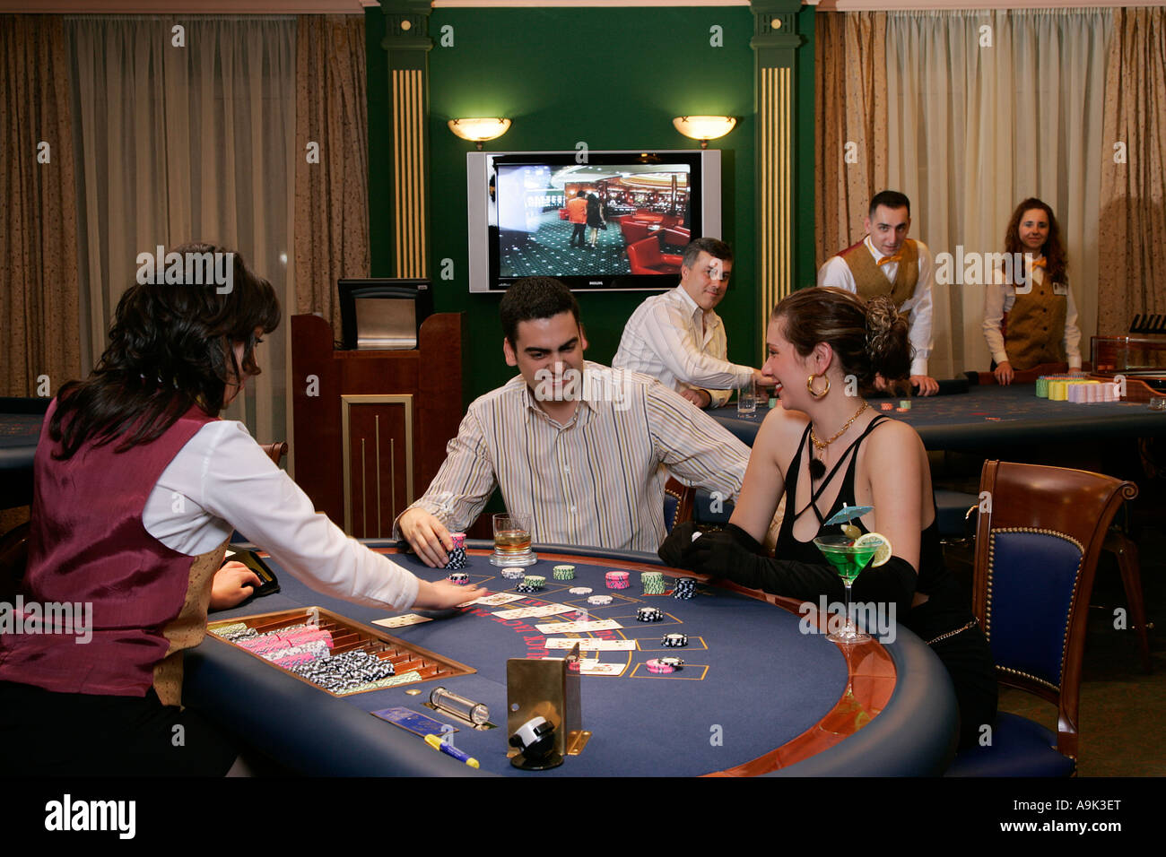 Young woman and man gambling play cards blackjack casino enjoy Stock Photo - Alamy