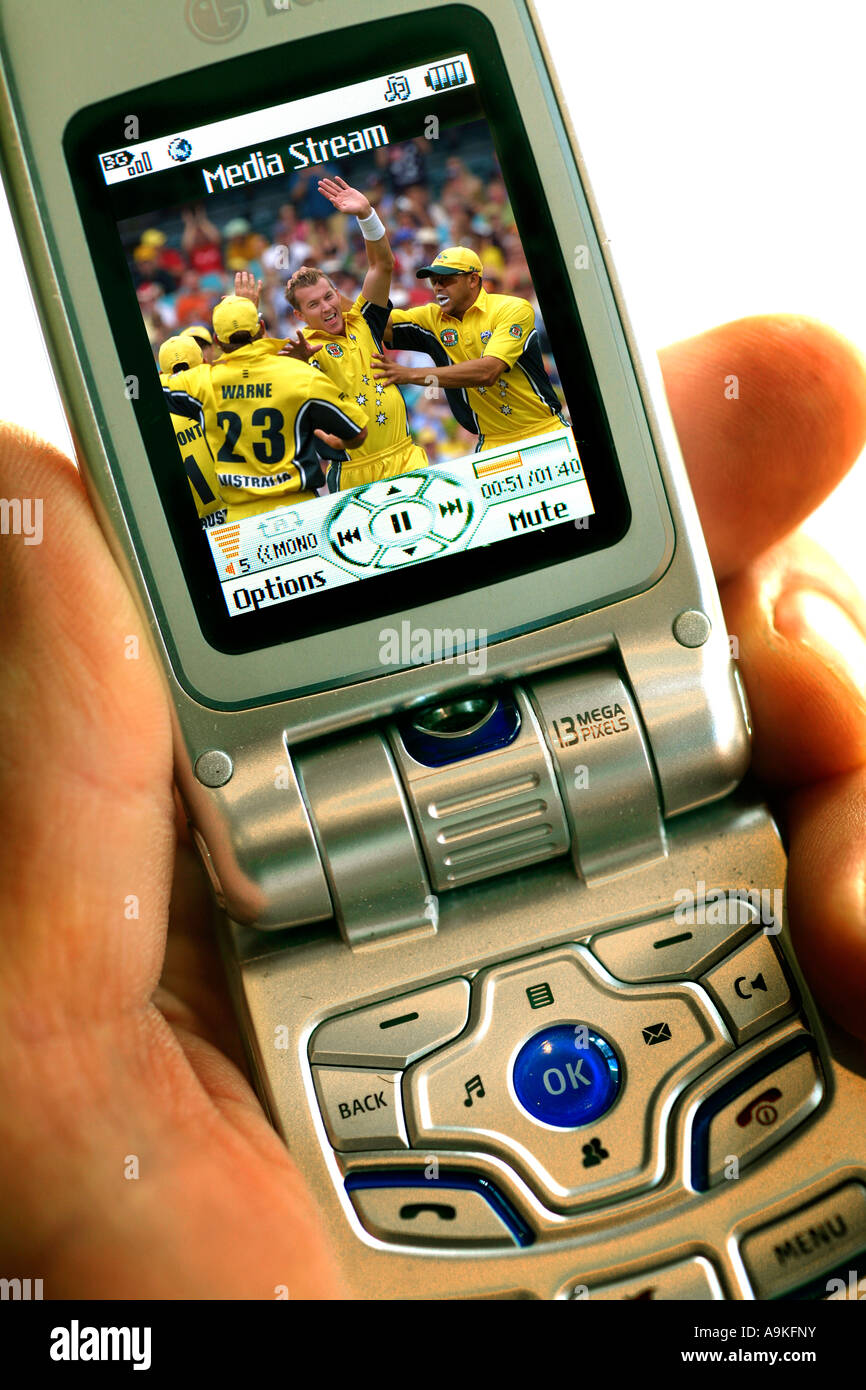Watch cricket video download on a cell phone Stock Photo