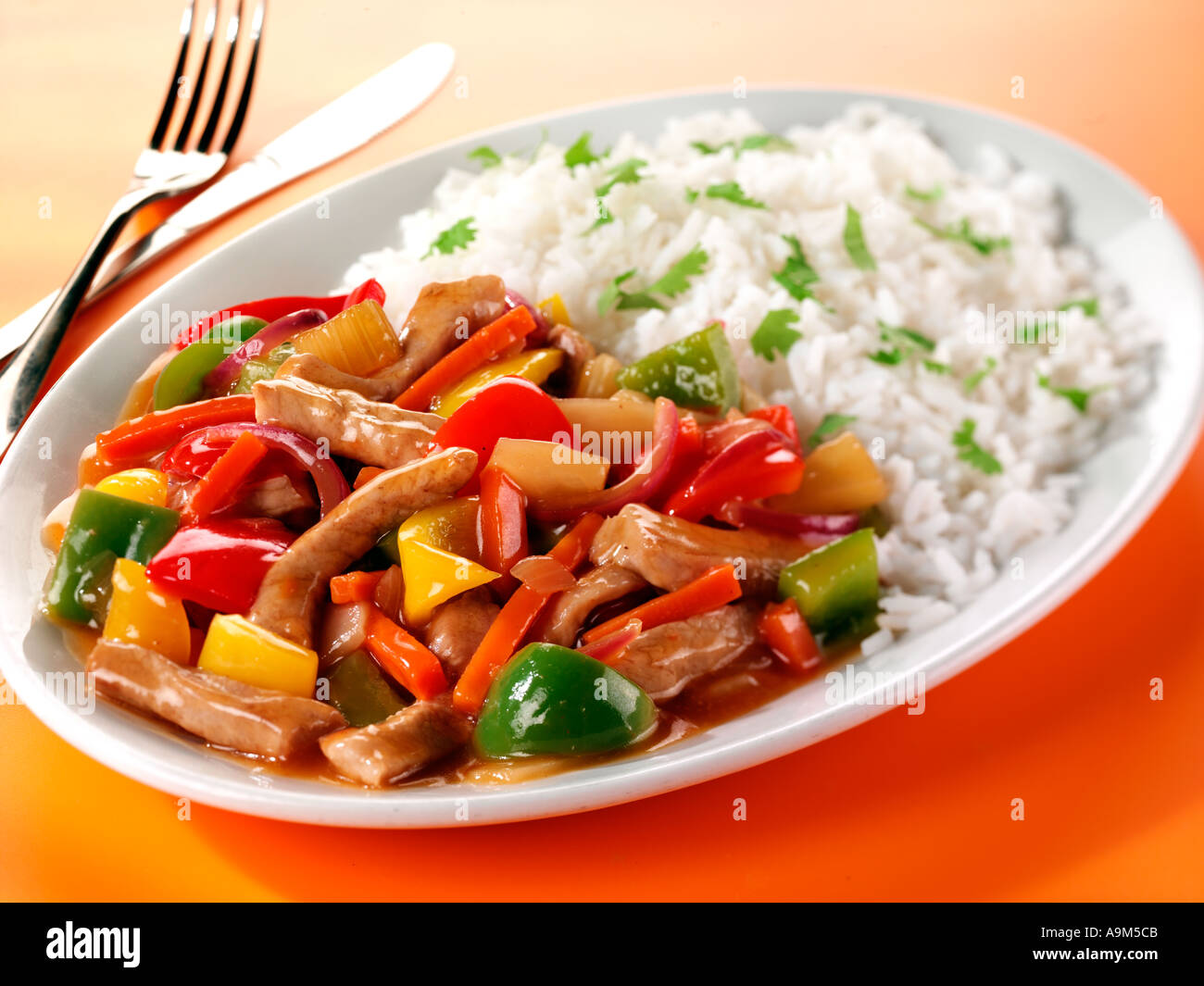 SWEET AND SOUR PORK WITH RICE Stock Photo