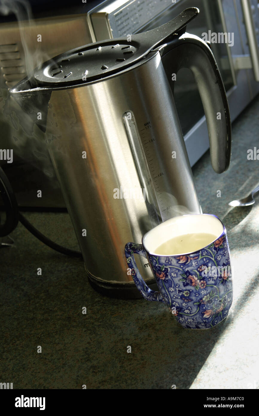 Stainless Steel Kettle Boiled Water in Cup Drink Stock Photo Alamy