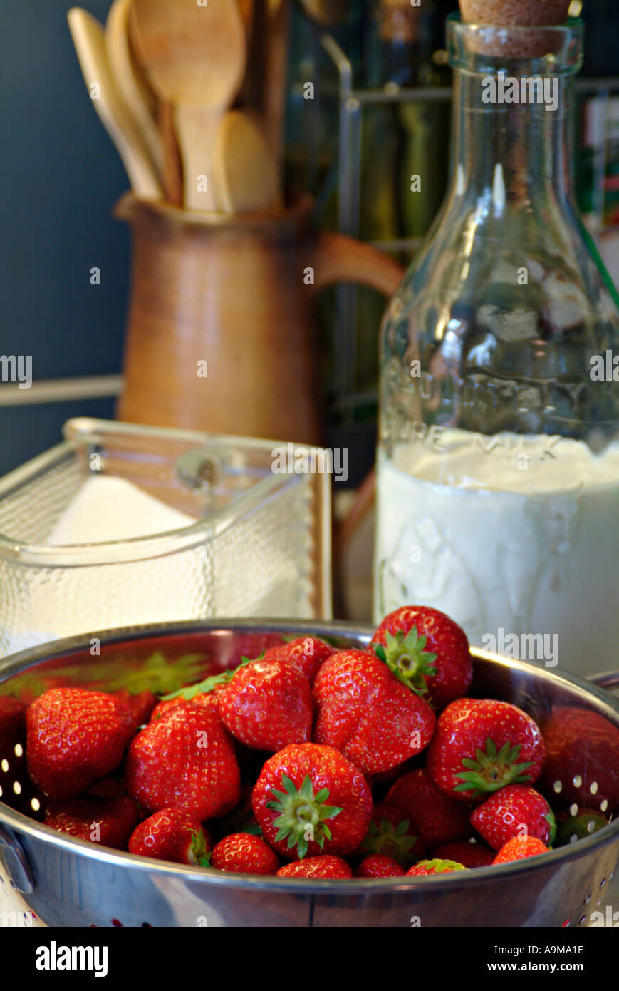 stil life with fresh strawberries sugar and milk Stock Photo
