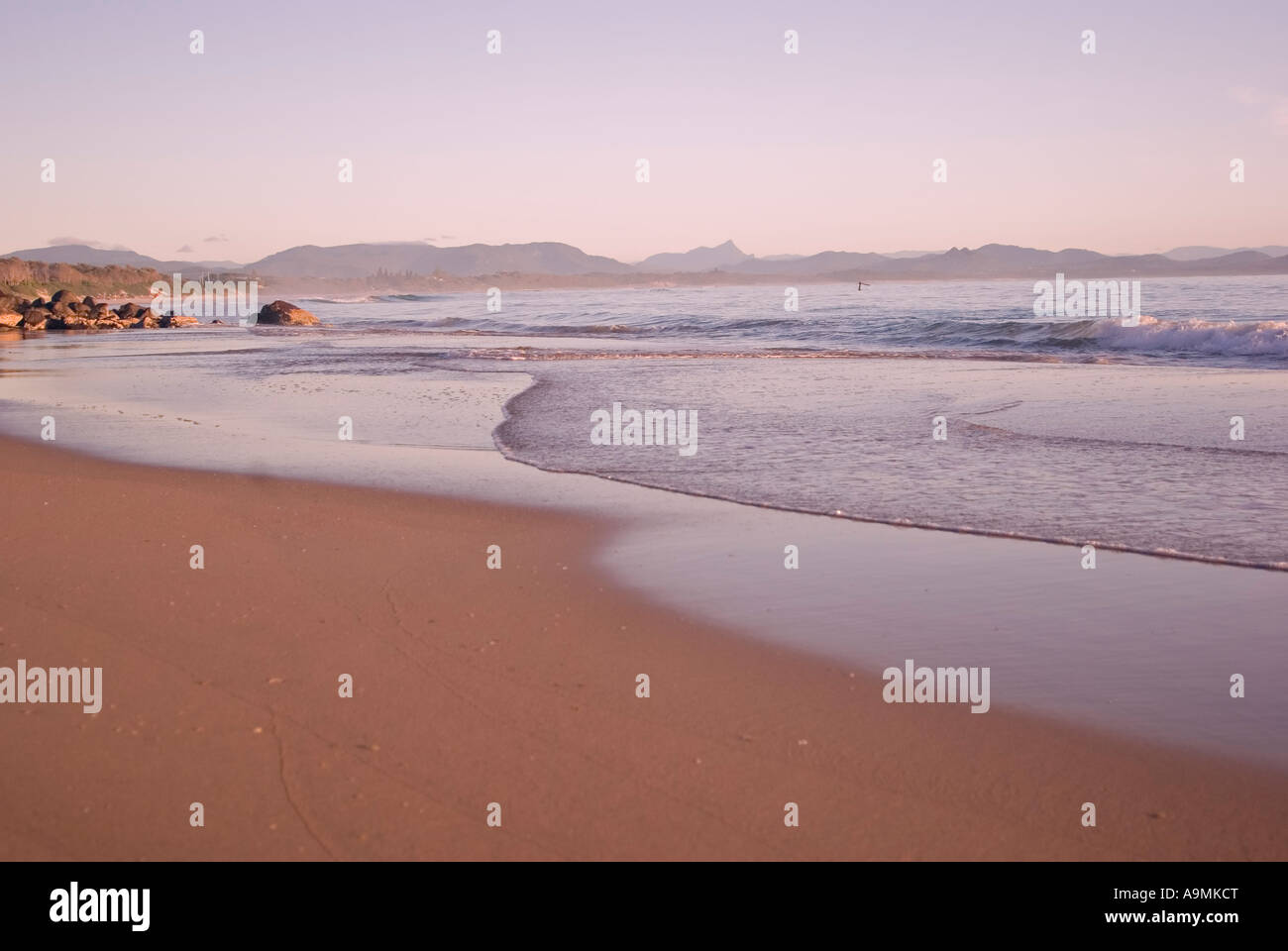 the waves are gently coming in on the tropical sandy beach Stock Photo
