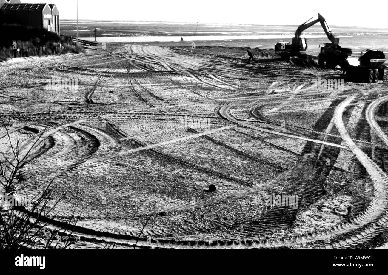 Patterns on a beach made by mechanical digger Stock Photo - Alamy