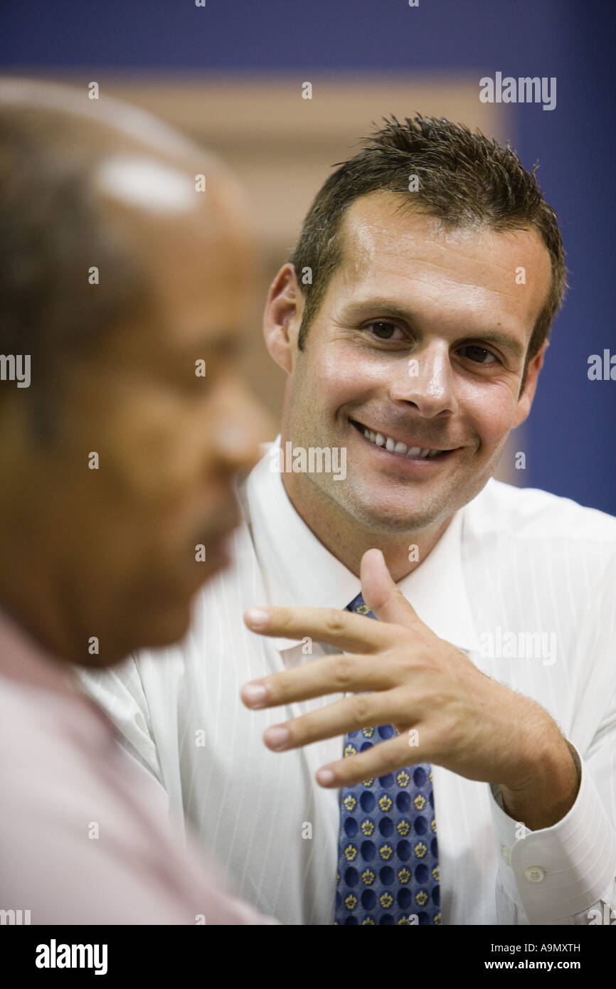 Close up of businessmen conversing Stock Photo - Alamy