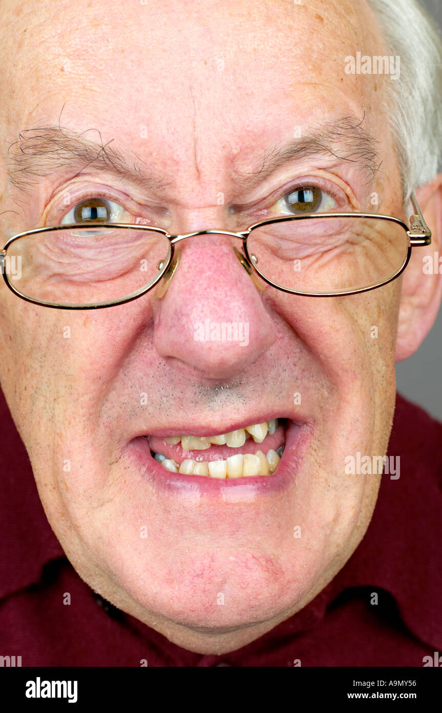 elderly man vertical close up pulling a funny face Stock Photo - Alamy