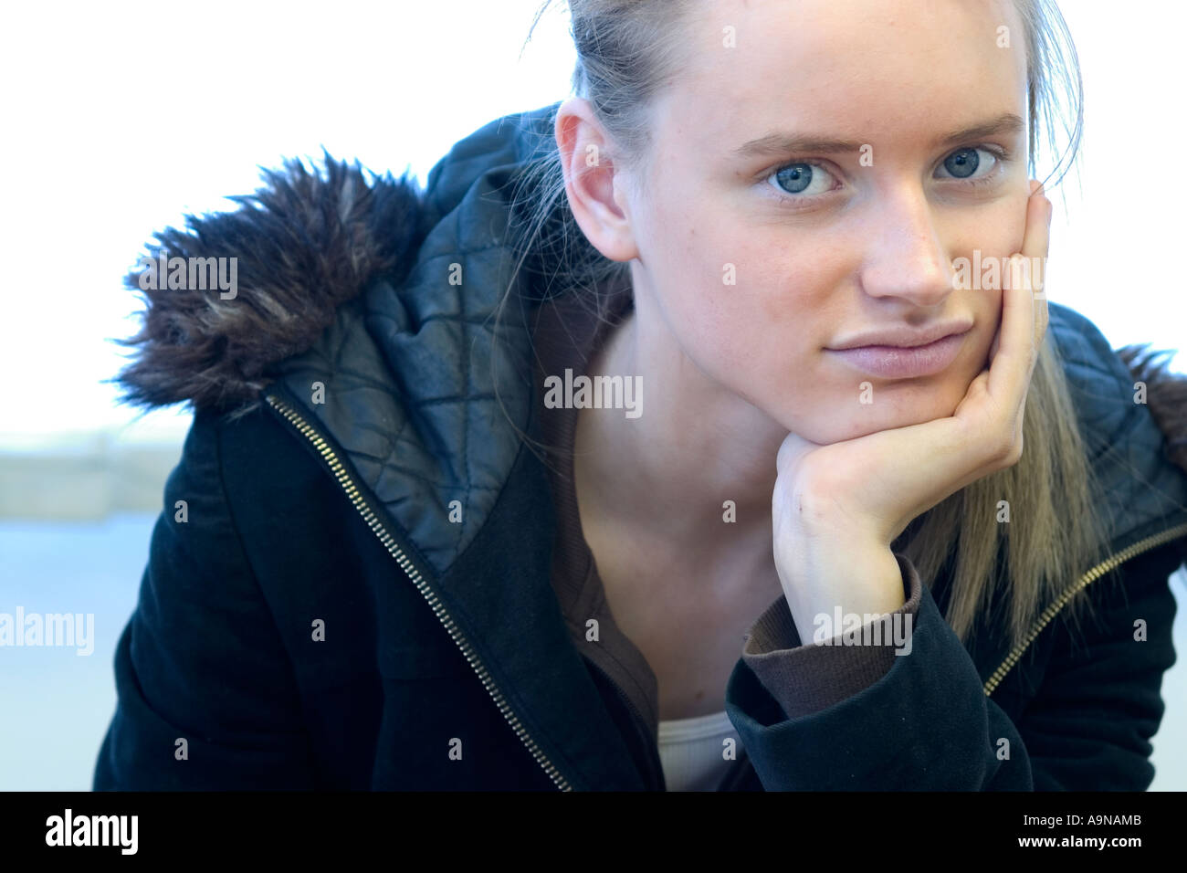 teenage girl resting head on hand Stock Photo - Alamy