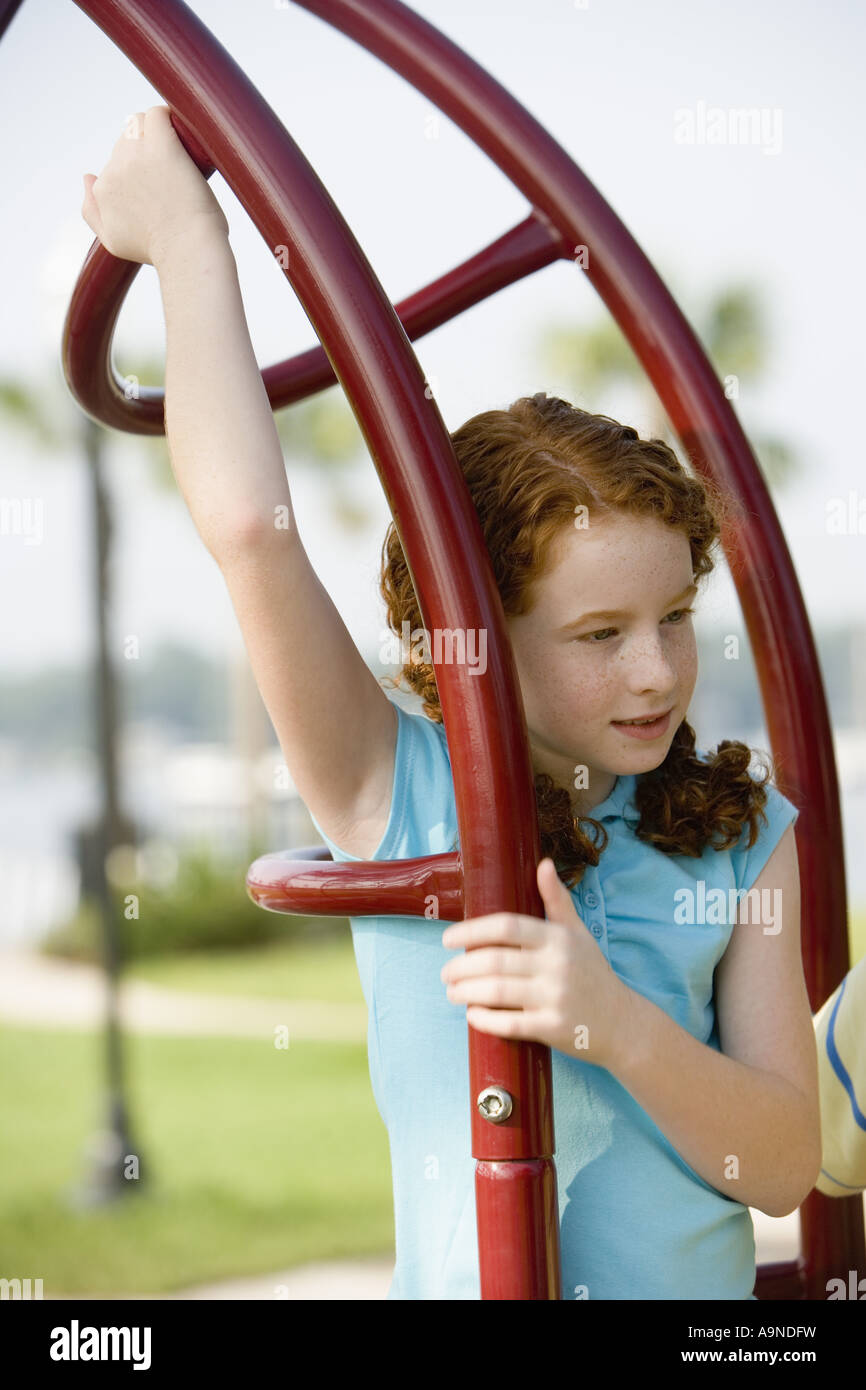 Girl climbing on monkey bars hires stock photography and images Alamy