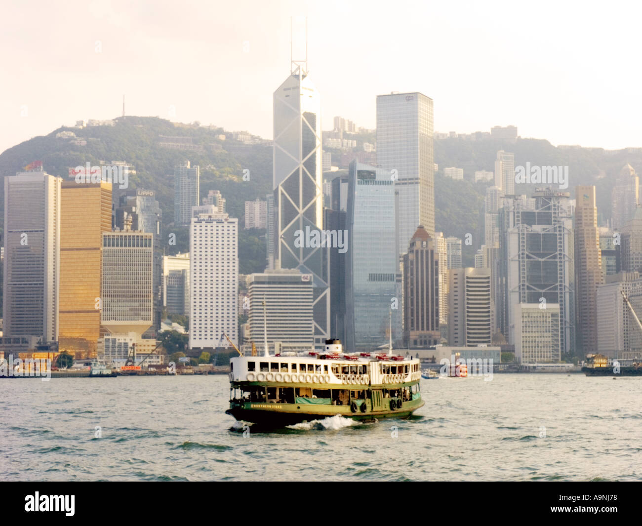 China Hong Kong Victoria harbour harbor skyline ferry skyscraper building financial center Stock Photo