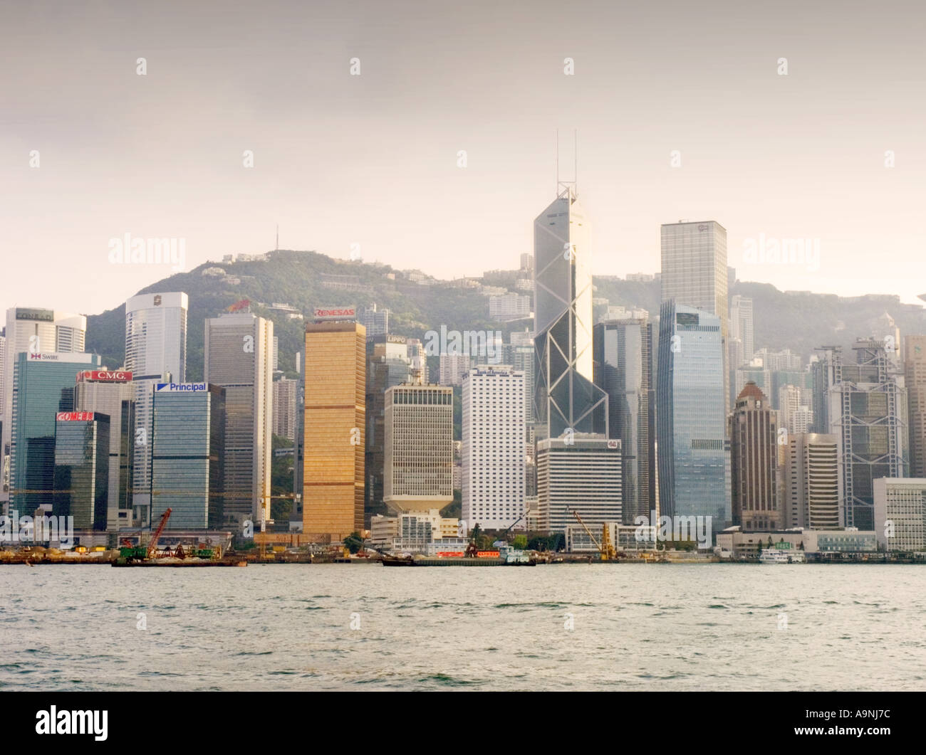 China Hong Kong Victoria harbour harbor skyline ferry skyscraper building financial center Stock Photo