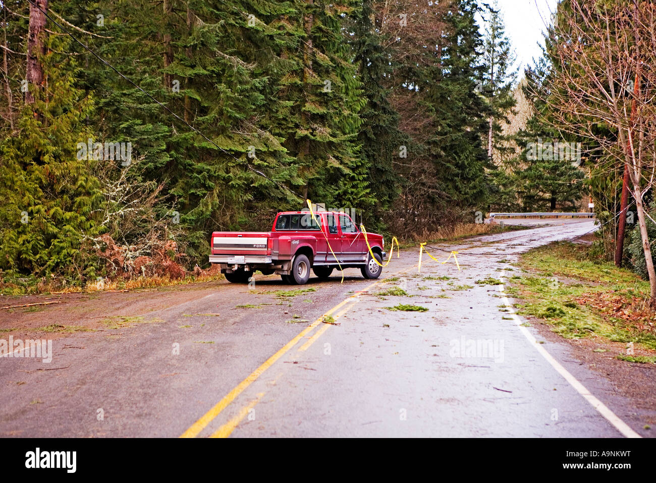 Image of a car and a truck driving opposite directions taking turns