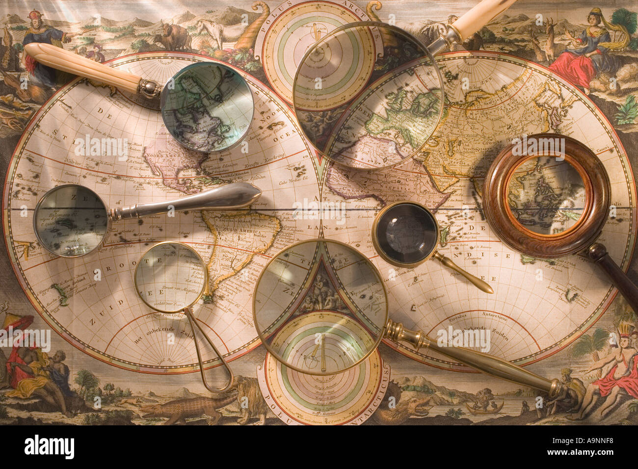 Still life of old map with magnifying glasses Stock Photo