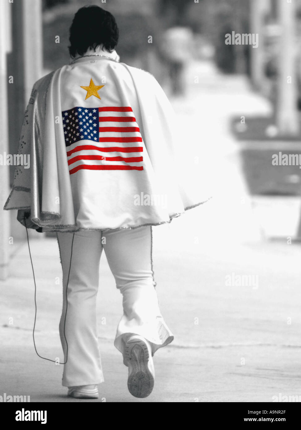 Rear view of Elvis Presley lookalike off Sunset Boulevard, Los Angeles - Black and white with Spot colour stars and stripes - Stock Photo