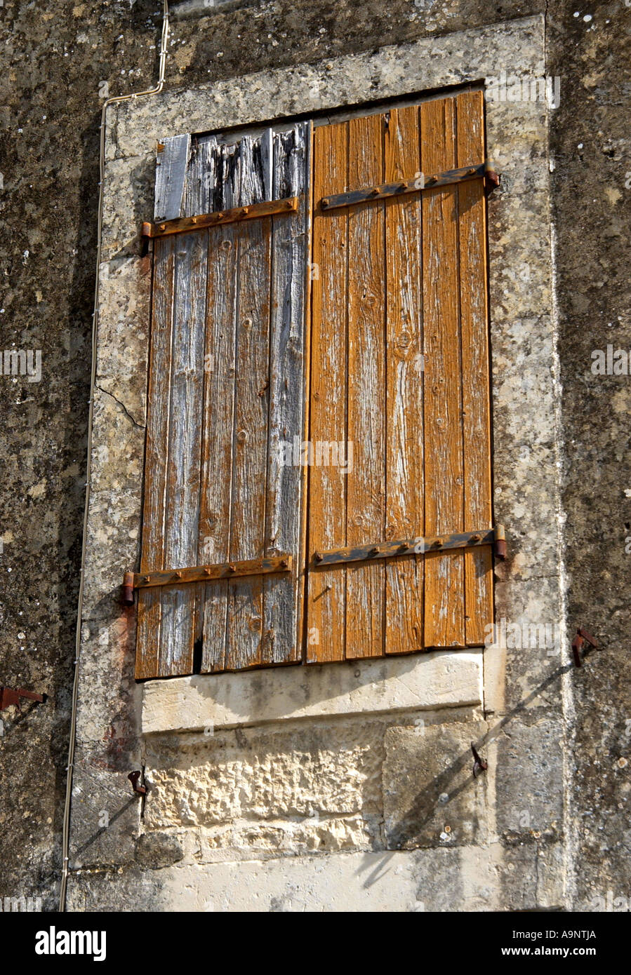 Neglected wooden shutters Stock Photo