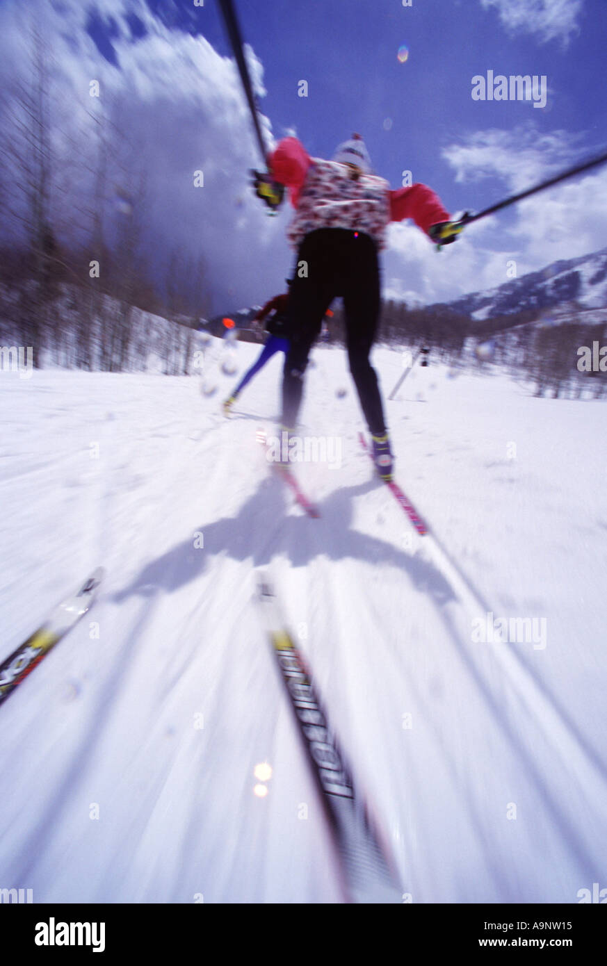 A blurry shot of a woman cross country skiing at Sundance UT Stock Photo