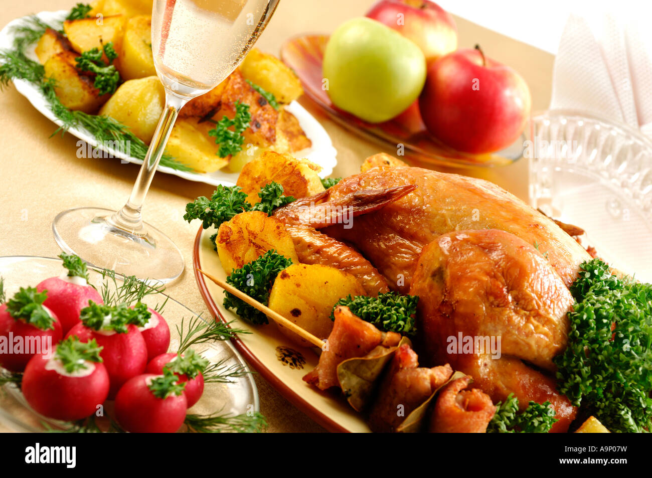 Festive roast chicken and fried appetizing potatoes Holiday dinner Stock Photo