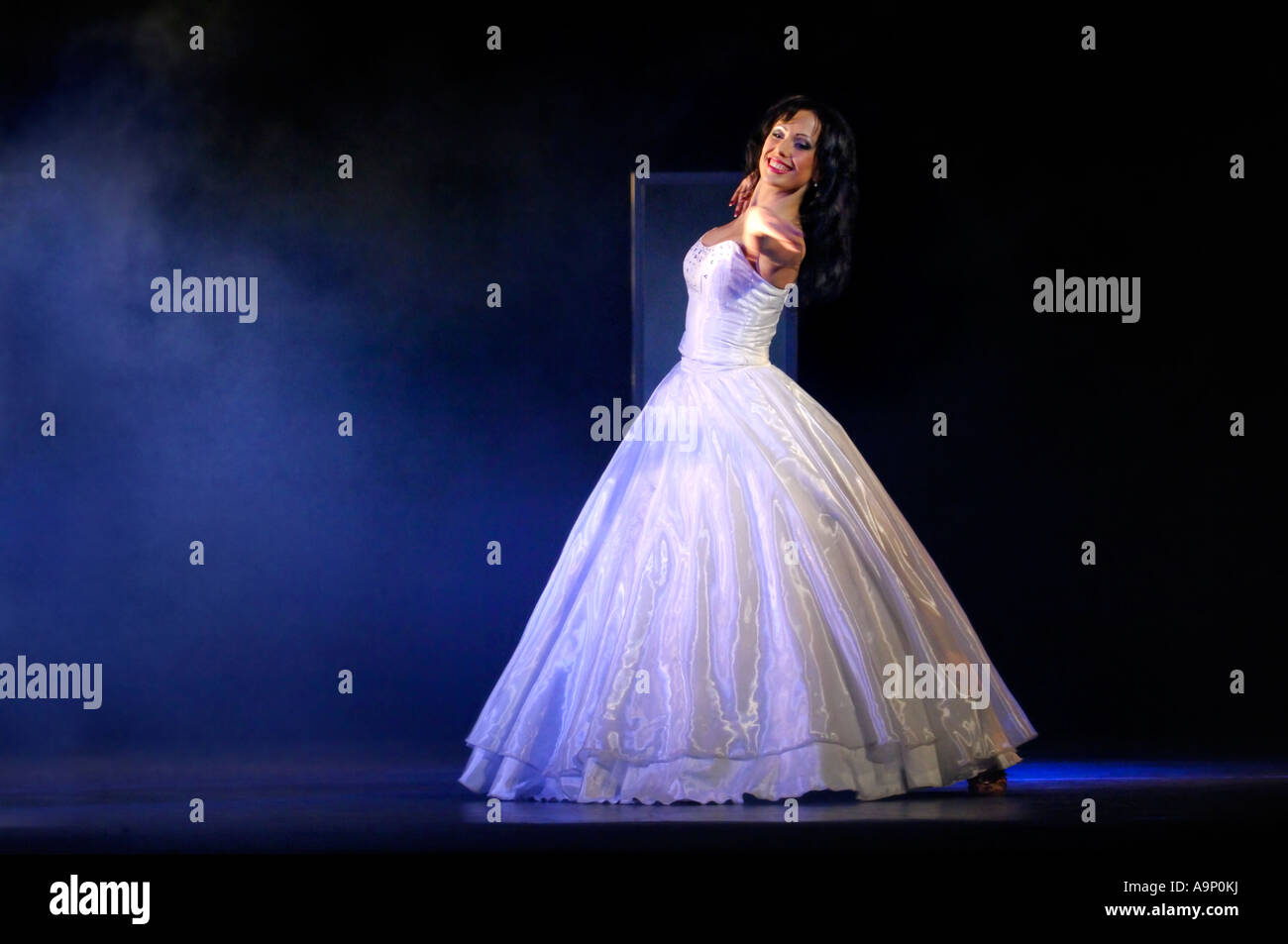 Woman dancing with blue dress hi-res stock photography and images - Alamy