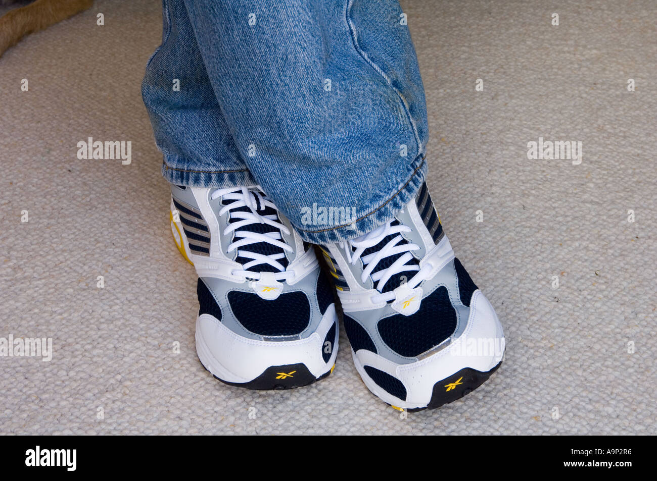Man wearing jeans sneakers hi-res stock photography and images - Alamy