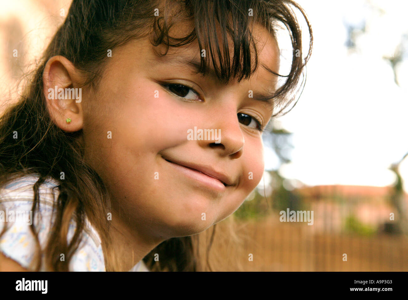 Portrait of smiling young girl Stock Photo