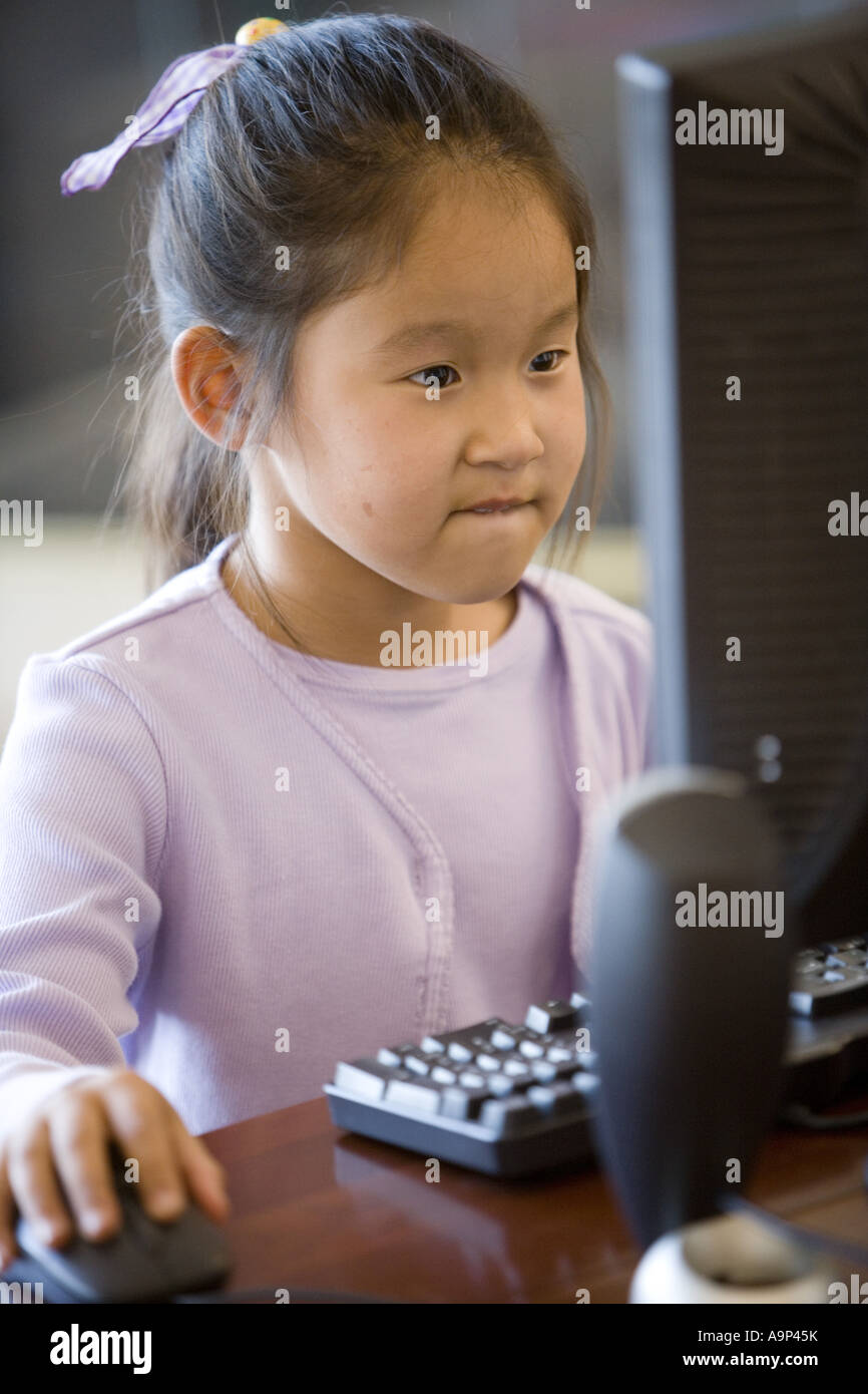 Young Asian giirl using computer Stock Photo - Alamy