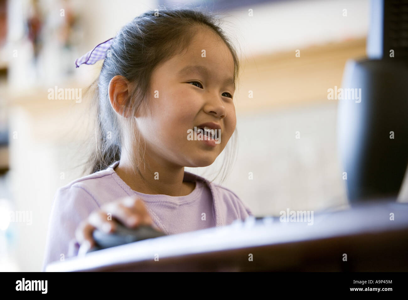 Young Asian giirl using computer Stock Photo - Alamy