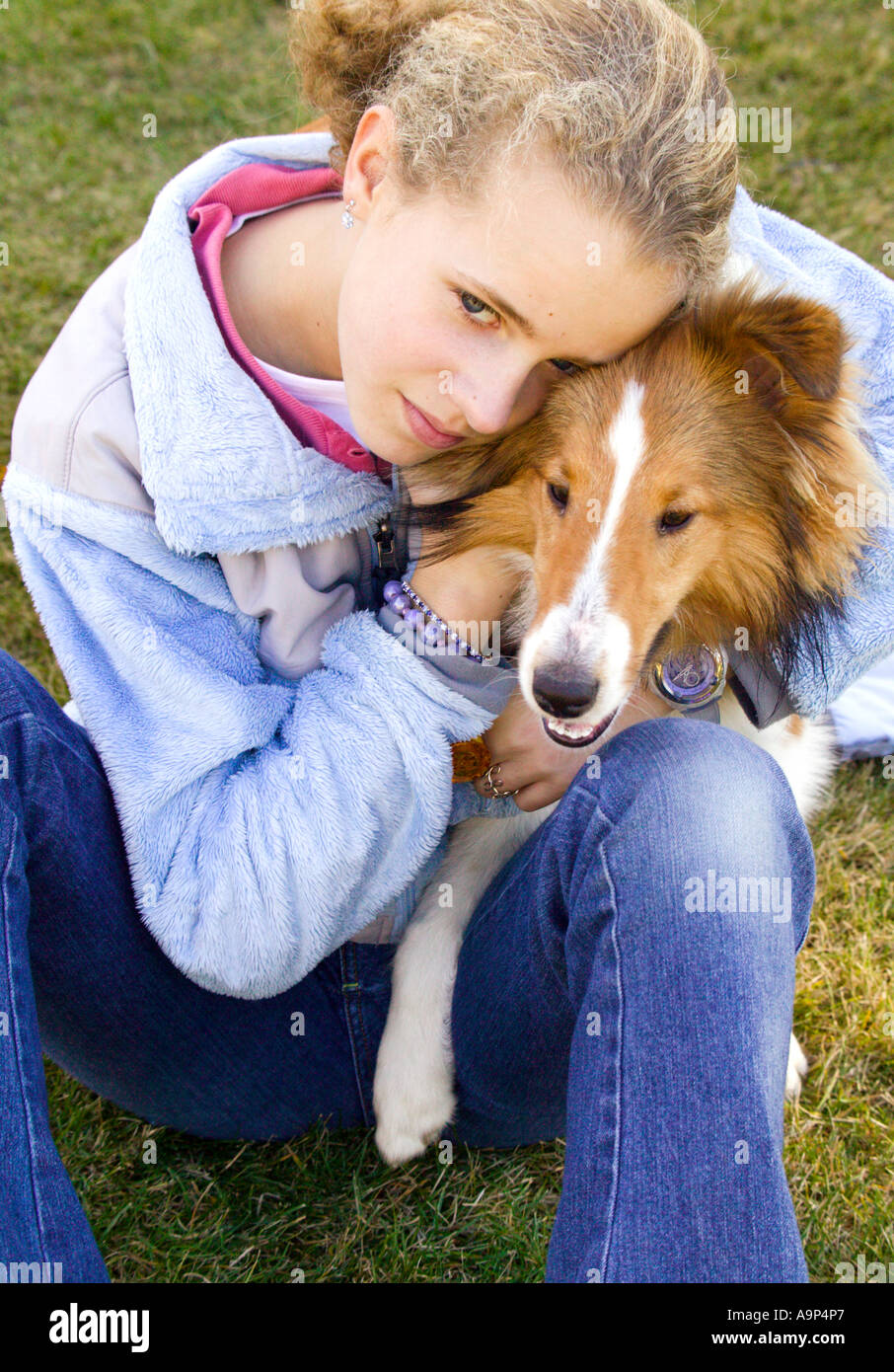 Portrait of girl hugging dog Stock Photo